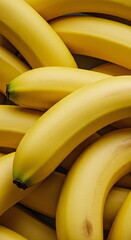 A close-up of a pile of ripe yellow bananas, emphasizing their texture and abundance.