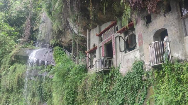 Yinhe Cave Hiking Trail, The waterfall that falls straight down from the cliff on the mountainside is very popular among travelers for its ethereal and beautiful scenery, New Taipei City, Taiwan