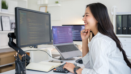Programmer working on software development in a modern workspace.