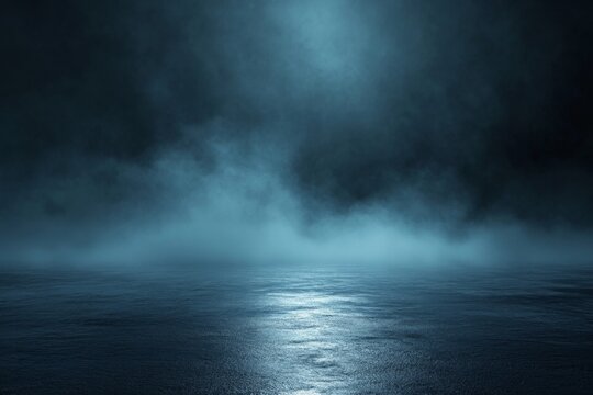 Dark, misty, reflective surface lit by a soft blue light