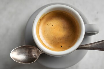 Perfectly Brewed Cup of Espresso Captured in Detail from Above with Spoon and Saucer