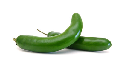 Fresh green cut chili pepper pieces on a white background