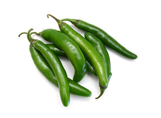 Fresh green cut chili pepper pieces on a white background