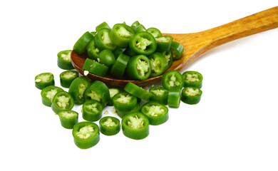 Fresh green cut chili pepper pieces on a white background