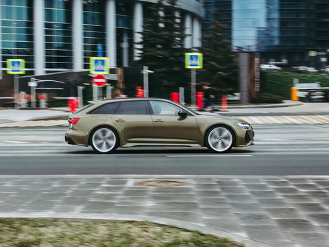 Sage Green Audi RS6 car moving on the street