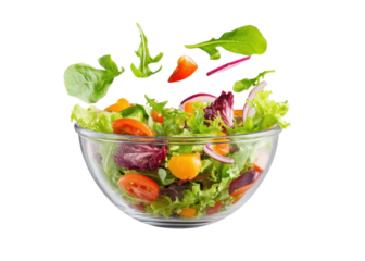 Fresh salad with flying vegetables in a glass bowl on a transparent background. Concept of healthy eating, diet, and vegetarian food.