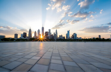 Obraz premium City Skyline at Sunset with Radiant Sun