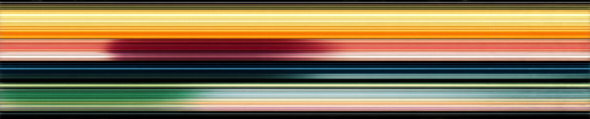 A series of colored pencils are lined up in a row