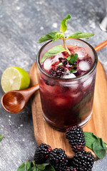 Refreshing cold mojito drink with natural raspberries
