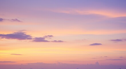 Obraz premium Sky with soft pastel colors: purple pink and yellow at sunset or sunrise.
