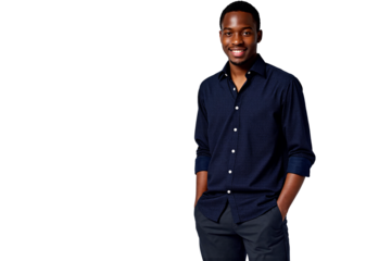 Confident young Black man smiling warmly and looking directly at the camera, dressed smartly in a dark navy blue long-sleeve button-down shirt and dark trousers, hands casually placed in pockets