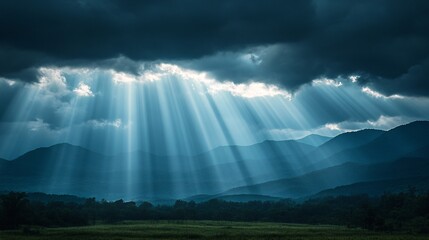 Sunbeams breaking through clouds after rain over a mountain range texture background