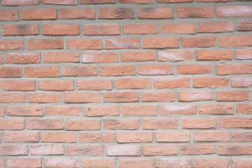 Brick wall with warm tones and textured surface