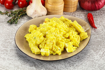 Italian cuisine - yellow risotto with chicken