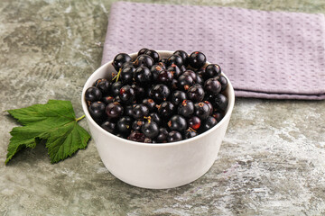 Ripe black currant in the bowl