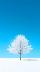 Solitary Snow Covered Tree Against Vibrant Blue Sky