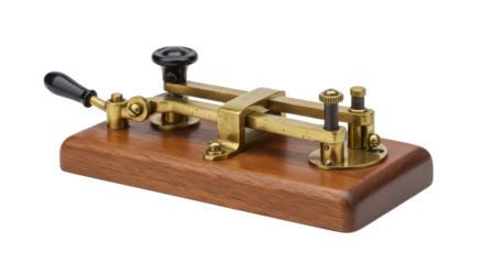 A close up of a vintage morse code key on a wooden base with brass components and black handles
