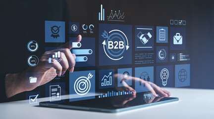 Business person using interactive B2B analytics interface on digital tablet screen.