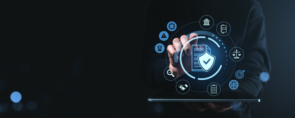 Cybersecurity interface with data protection symbols on digital tablet screen.