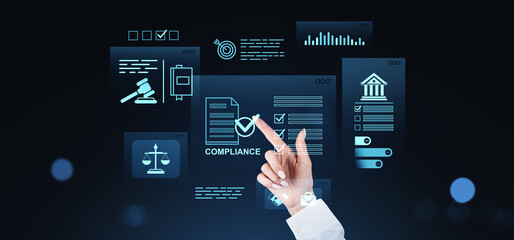 Business hand interacting with virtual compliance interface showing legal, regulatory, and data...