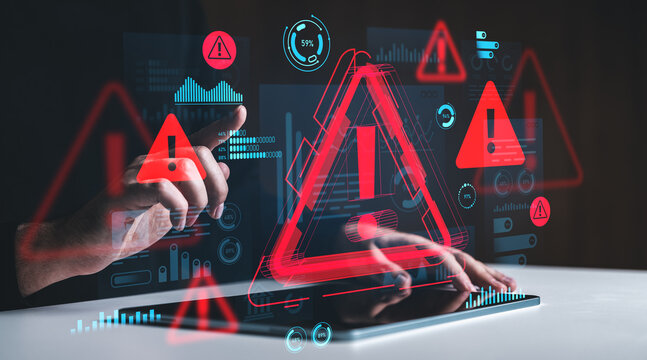 Cybersecurity alert concept with hands interacting with digital warning symbols and data charts on futuristic creative background screen interface.