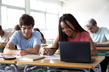 Naklejka premium High school students taking test in classroom