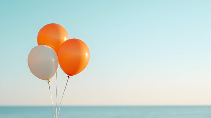 Fototapeta premium Three Pastel Balloons Against a Blue Sky and Calm Ocean