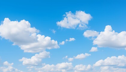 Clear blue sky filled with soft, fluffy white clouds floating gently, creating a bright and peaceful atmosphere on a sunny day with natural daylight
