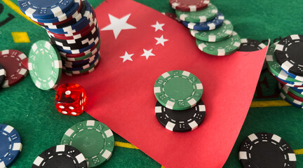 Chips from casino. Flag of China. Gambling business of People Republic of China. Games for money in PRC. Gambling in Chinese casinos. Background for China gambling industry. Casino in Beijing