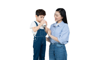portrait of asian boy drinking milk and posing with mother on background