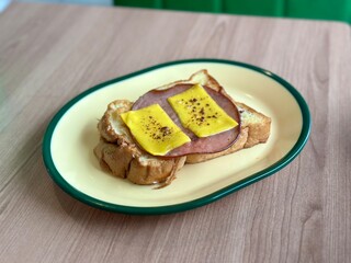 Toast with ham and cheese—golden, crispy bread layered with savory ham and melted cheese, a classic comfort food perfect for breakfast or a quick snack. April 6. 2025 - Cisauk, Indonesia.