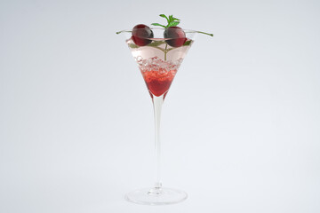 Cocktail drink red with ice and fruit isolated at white