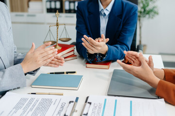 Asian team and lawyers discussing contract papers coworker, teamwork celebrating...