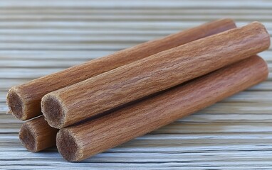 Three Brown Cinnamon Sticks Closeup  Wooden Texture Spicy Aromatic