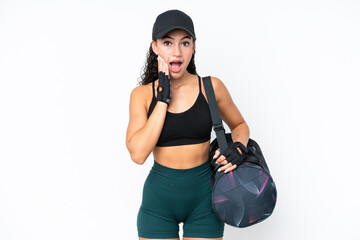 Young sport woman with sport bag isolated on white background with surprise and shocked facial...