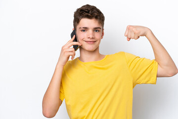 Teenager man using mobile phone isolated on white background doing strong gesture