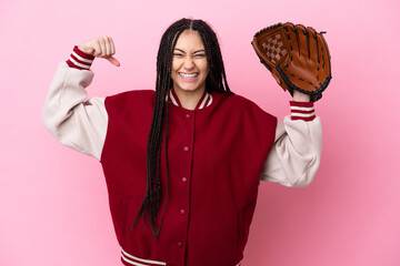 Teenager player with baseball glove isolated on pink background doing strong gesture