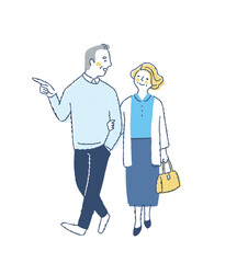 並んで歩いている笑顔のミドル・シニアカップル