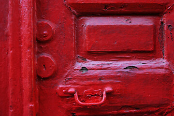 Old vintage wooden house door with brass