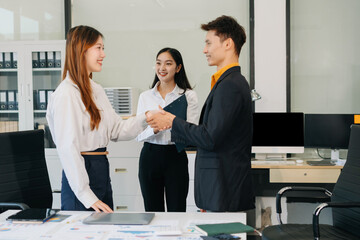 Successful business team, excited young people happy working.