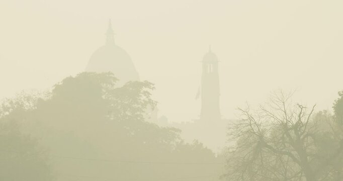 Delhi, India. Silhouette of a Central dome, Bell tower. Secretariat Building or Central Secretariat houses the important ministries of the Government of India. Air pollution is an environmental