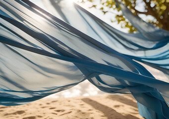 transparent wavy blue fabric on the shore