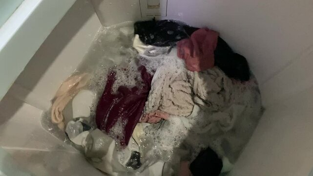 Washing clothes process inside top load washing machine
