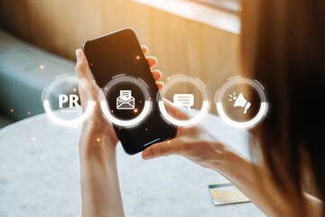 PR, Public relations concept. hands using laptop and tablet with public relations icon for...