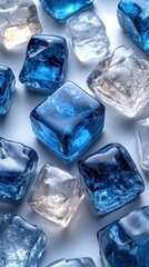 Obraz premium Blue and Clear Ice Cubes on a Reflective Surface