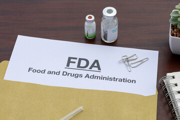 Health Regulation Notice: FDA Document on Doctor’s Wooden Desk