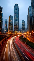 Obraz premium Urban highway at twilight, city skyscrapers