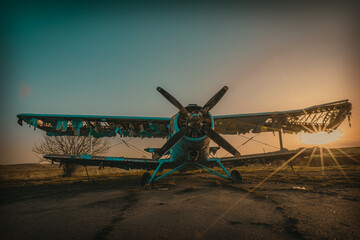 Abandoned aircraft field wirn AN-2 on it