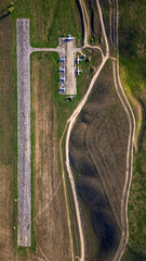 Abandoned aircraft field wirn AN-2 on it