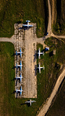 Abandoned aircraft field wirn AN-2 on it
